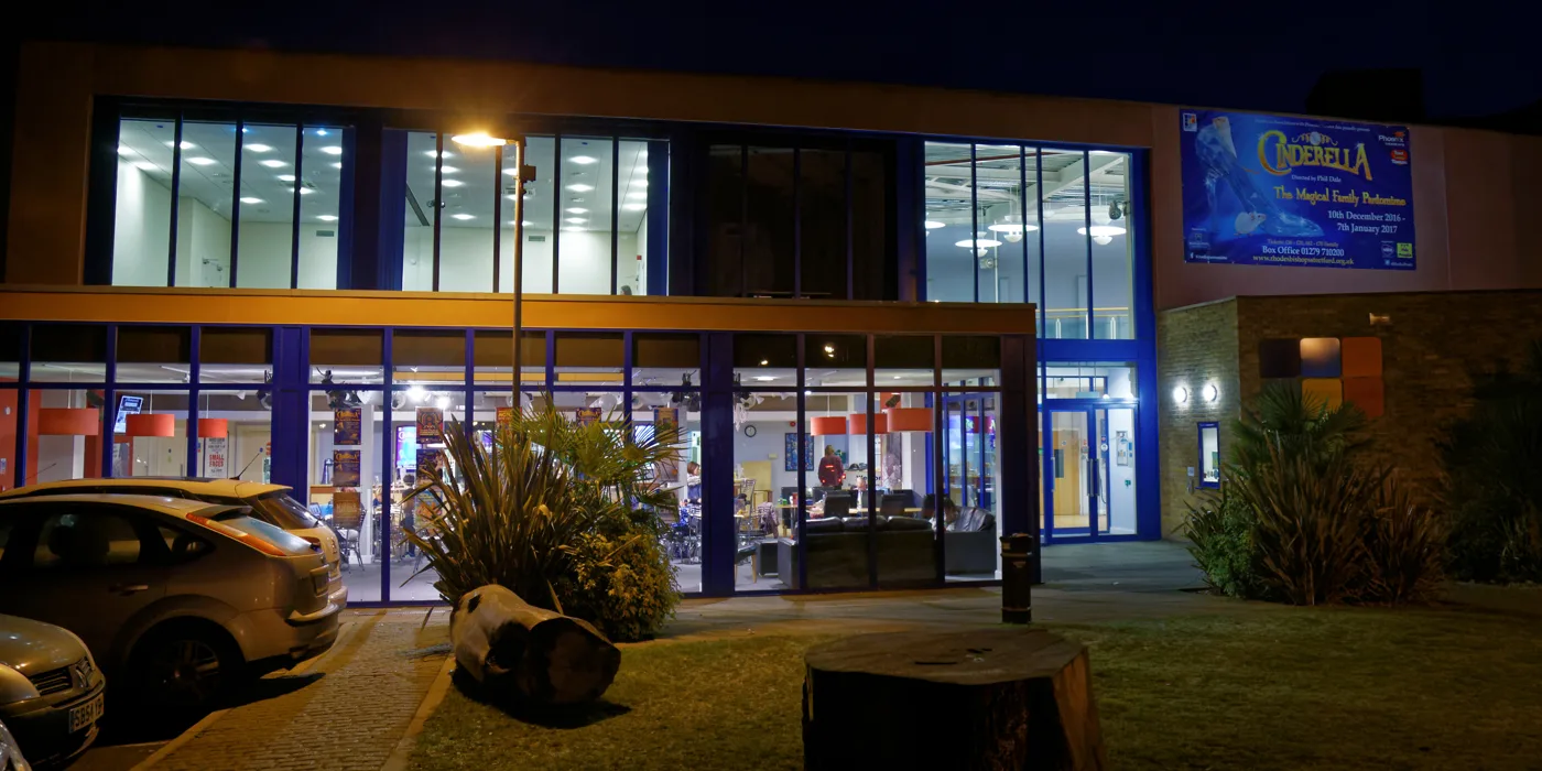 The theatre on South Road at night, in its Rhodes Arts Complex days. It is now South Mill Arts, and the pantomime banner is still a fixture every winter